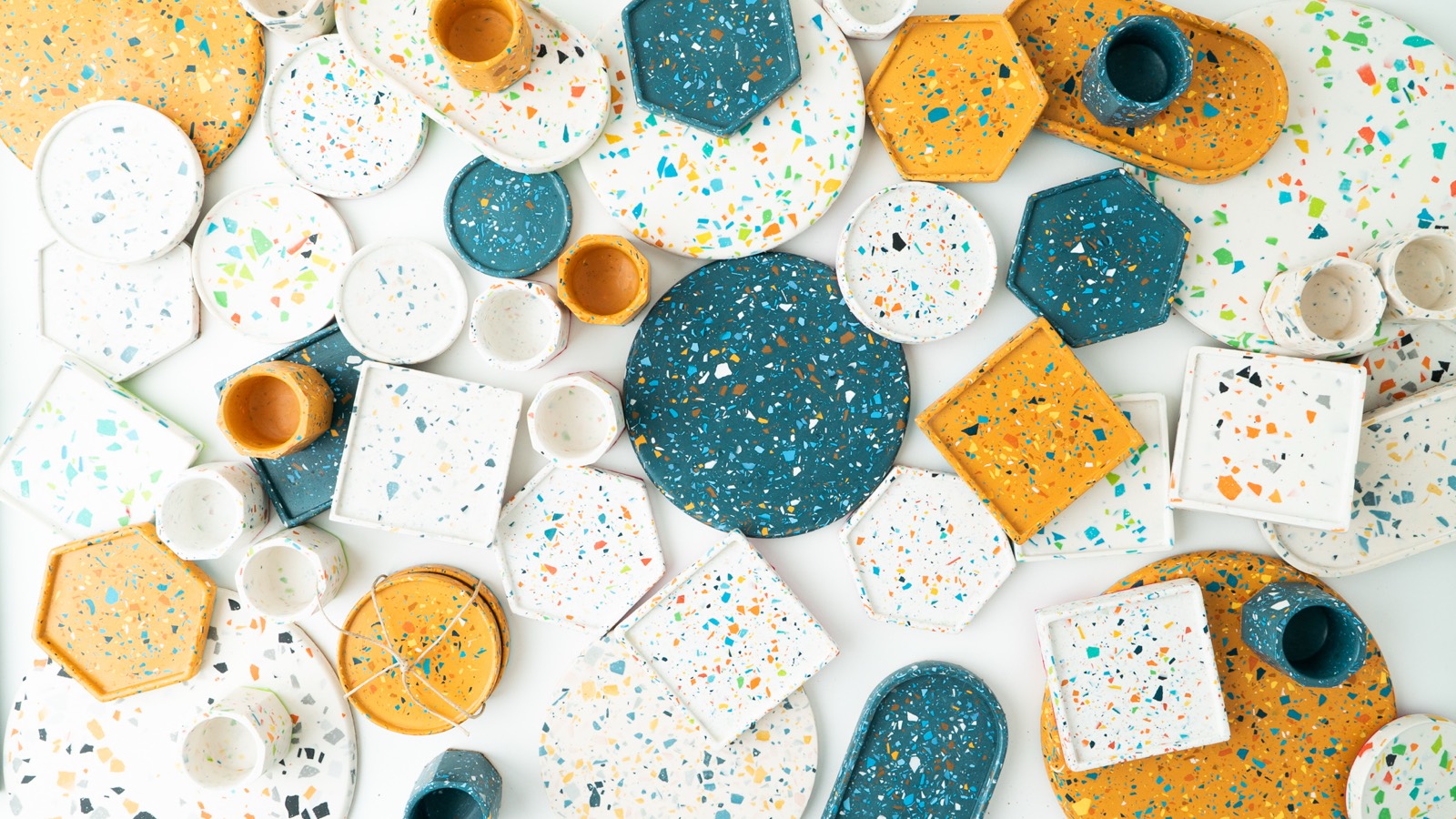 Terrazzo coasters, trivets and holders laid out together